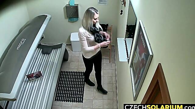 Girl relaxes in solarium not knowing about hidden cams